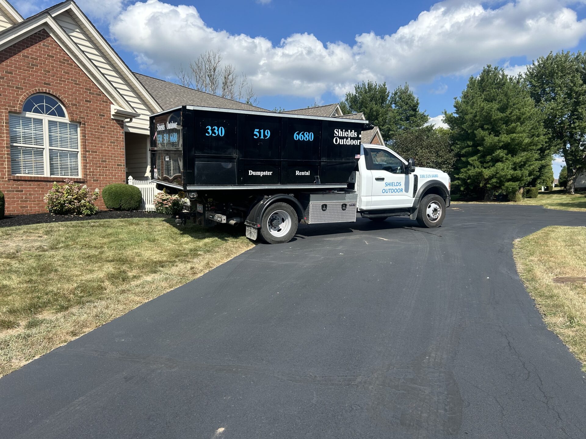 shields outdoor work truck parked in a driveway